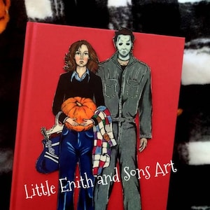 May include: A hand-painted illustration of a woman holding a pumpkin and a man wearing a mask. The woman is wearing a blue shirt, blue jeans, and a plaid scarf. The man is wearing a gray jumpsuit. The background is red and the text "Little Enith and Sons Art" is written in white.