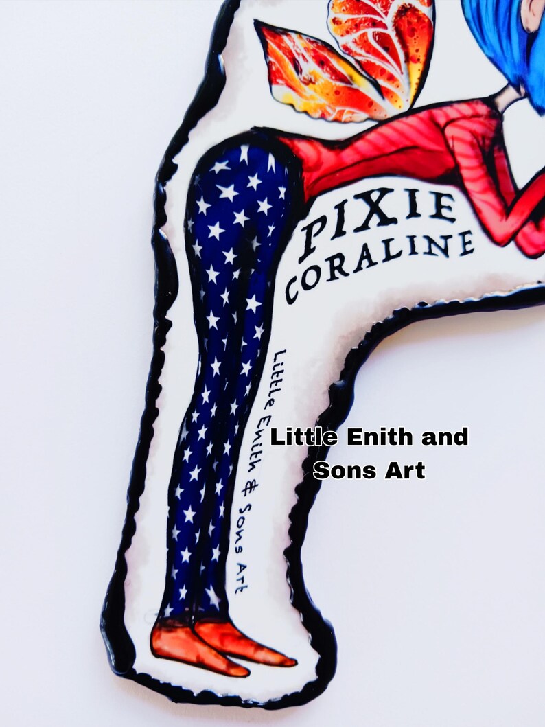 May include: A whimsical art piece featuring a stylized figure with blue hair and red clothing. The figure's legs are adorned with a blue and white star pattern, and the text "PIXIE CORALINE" is visible. The artwork is signed "Little Enith and Sons Art."