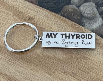 My Thyroid Is A Lying Ho Keychain, Funny Thyroid Gift, Hypothyroidism Keychain, Hashimoto’s Gift, Chronic Illness Humor Gift