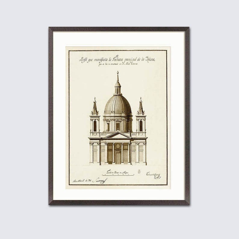May include: Framed sepia-toned architectural print depicting a domed building with columns and towers. The print includes text at the top and bottom, set against a white background within a dark frame. A classic piece of art.