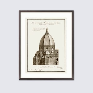 May include: Framed sepia-toned architectural print showing a detailed illustration of a domed cathedral. The artwork includes architectural details and text in a script font. The print is set within a white mount and a dark brown frame.