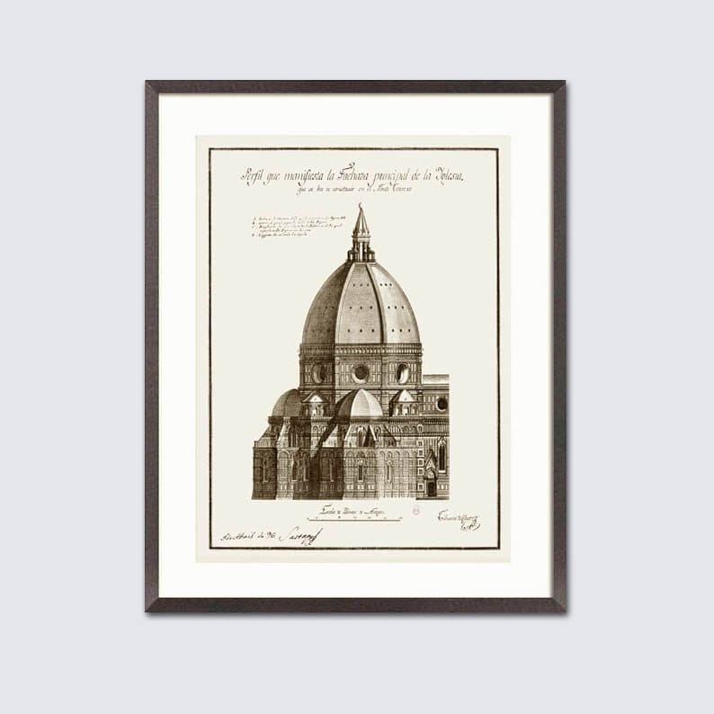 May include: Framed sepia-toned architectural print showing a detailed illustration of a domed cathedral. The artwork includes architectural details and text in a script font. The print is set within a white mount and a dark brown frame.