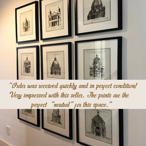 May include: Nine framed architectural prints with black frames are displayed on a white wall. The prints feature detailed black and white illustrations of buildings with domes and classical designs. The prints are arranged in a grid pattern.