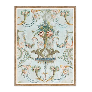 May include: A framed print with a vintage floral design on a pale blue background. The artwork displays elaborate floral arrangements, garlands, and decorative elements in pink, green, and gold. The print is enclosed within a wooden frame.