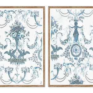 May include: Two framed prints featuring a blue and white floral pattern. The prints have a vintage style design with a distressed look.