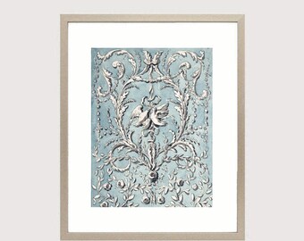 May include: A framed print of a vintage blue and white floral design with a pair of birds in the center.