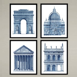 May include: Set of four blue and white architectural prints featuring the Arc de Triomphe, St. Peter's Basilica, the Pantheon, and a building with a balcony. The prints are framed in black.
