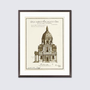 May include: Framed sepia-toned architectural print depicting a domed building with intricate details. The print includes text and is set within a dark frame. The artwork is a vintage style drawing, suitable for home decor.