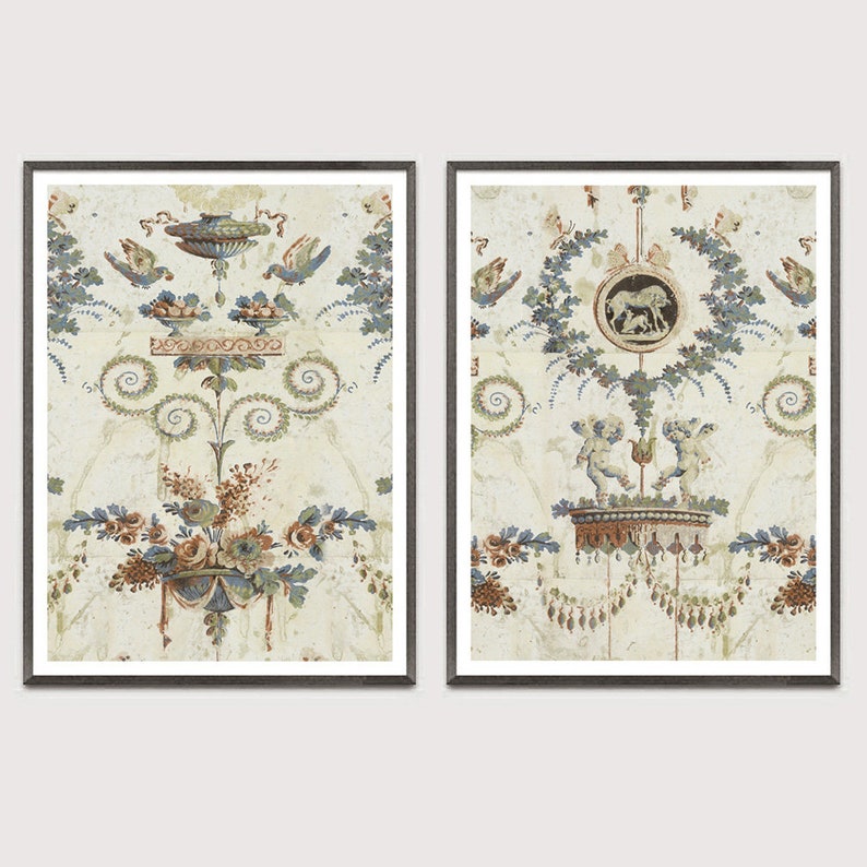 May include: Two framed prints with a vintage, faded look. Each print features a different design with a central motif of a vase with floral accents. The vase in the left print is topped with a bowl and birds. The vase in the right print is topped with two cherubs and a circular design with a horse inside.