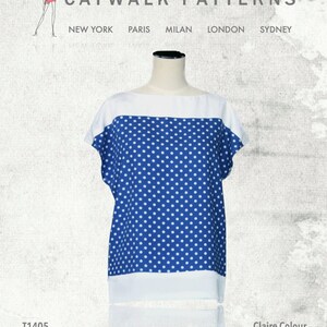 May include: A blue and white polka dot top with a white neckline and short sleeves. The top is on a mannequin. The text "Claire Colour Block Top" is at the bottom of the image.