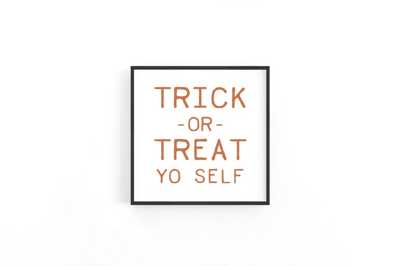 May include: A black framed print with the text "TRICK -OR- TREAT YO SELF" in orange.