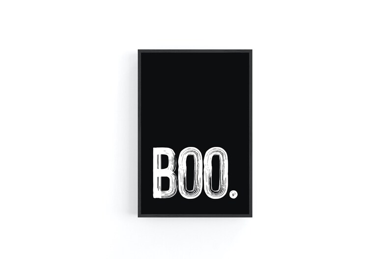 May include: A black and white print with the word "BOO" in a white, stylized font on a black background.
