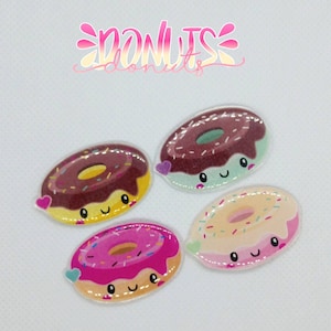 May include: Four colorful cartoon donuts with sprinkles and frosting. Each donut has a happy face and a pink heart.