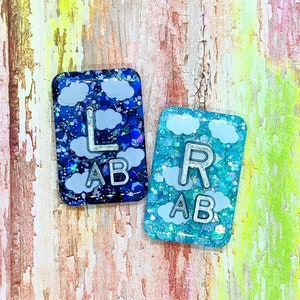 In the Clouds lead letter xray markers with initials
