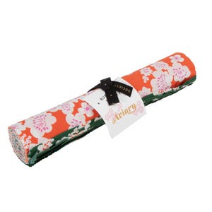 May include: Rolled fabric bundle featuring a floral pattern in shades of orange, white, and pink. The bundle is tied with a black ribbon and a tag that reads "Aviary". The fabric has a green border.