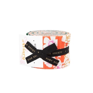 May include: A roll of fabric with a floral pattern in shades of orange, white, and pink, secured with a black ribbon. The ribbon has the text "RUBY STAR SOCIETY" printed on it. The fabric is likely for quilting or other craft projects.