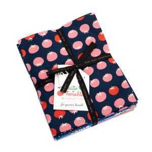 May include: A fat quarter bundle of fabric featuring a navy blue background with pink and red tomato patterns. The bundle is tied with a black ribbon and a tag that reads "Tomato Tomahkt" by Kimberly Kigh.