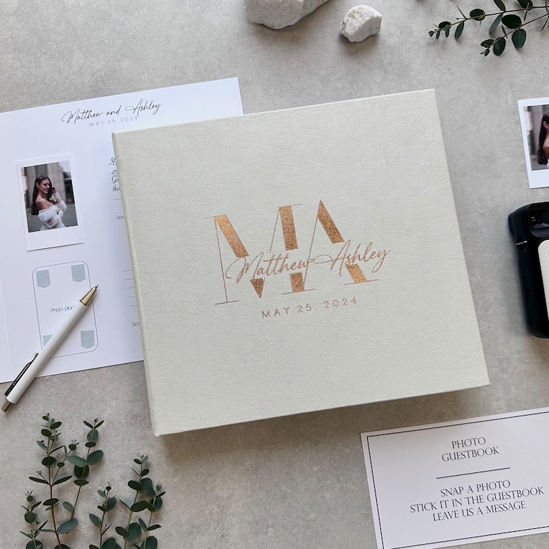Ivory Instax Wedding Guest Book With Copper Lettering, This modern Polaroid Guest book is more than just a sign-in book, this luxurious and personalized Instax photo album fits all instant film sizes — Instax Mini, Wide, Square, Photo Booth 4x6 prints, and 2x6 photo strips. Our wedding photo guest book that captures every smile, every laugh, and every special guest who made your day unforgettable — a timeless wedding keepsake you’ll treasure forever.