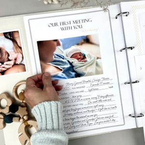 Inside pages of a handmade baby memory book designed to capture milestones and photo memories. Each page features dedicated spaces for firsts like smiles, steps, birthdays, and family moments. With its soft, minimal layout, parents can easily add, remove, or rearrange pages as their baby grows. Thoughtfully designed with photo areas and prompts for notes, this keepsake helps preserve every special moment from birth through the early years in a beautifully organized way.