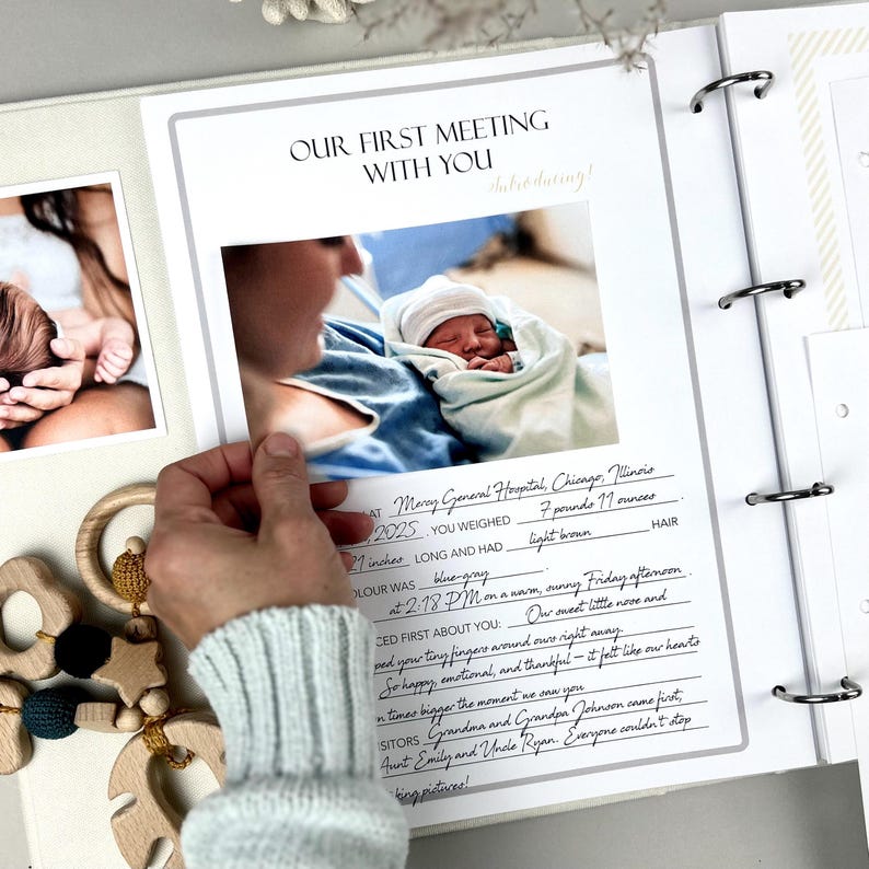 Inside pages of a handmade baby memory book designed to capture milestones and photo memories. Each page features dedicated spaces for firsts like smiles, steps, birthdays, and family moments. With its soft, minimal layout, parents can easily add, remove, or rearrange pages as their baby grows. Thoughtfully designed with photo areas and prompts for notes, this keepsake helps preserve every special moment from birth through the early years in a beautifully organized way.