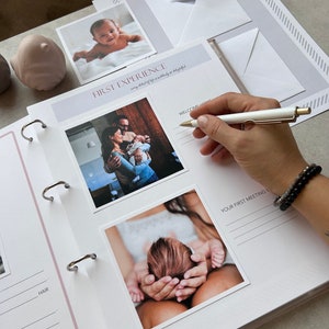 Inside pages of a handmade baby memory book designed to capture milestones and photo memories. Each page features dedicated spaces for firsts like smiles, steps, birthdays, and family moments. With its soft, minimal layout, parents can easily add, remove, or rearrange pages as their baby grows. Thoughtfully designed with photo areas and prompts for notes, this keepsake helps preserve every special moment from birth through the early years in a beautifully organized way.