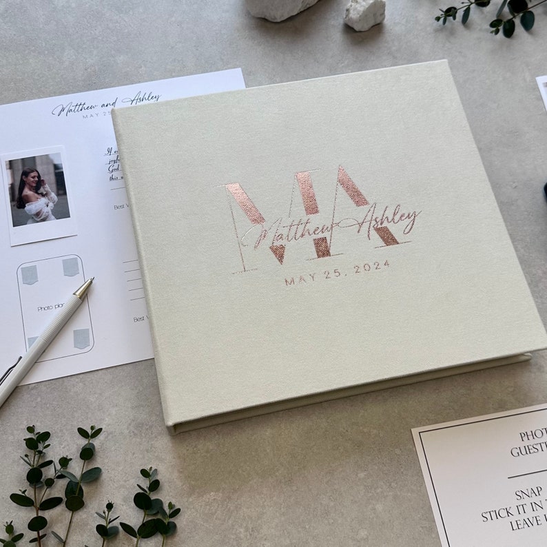 Ivory Instax wedding guest book with elegant Copper foil lettering. This modern Polaroid Guest book is more than just a sign-in book, this luxurious and personalized Instax photo album fits all instant film sizes — Instax Mini, Wide, Square, Photo Booth 4x6 prints, and 2x6 photo strips. Our wedding photo guest book that captures every smile, every laugh, and every special guest who made your day unforgettable — a timeless wedding keepsake you’ll treasure forever.