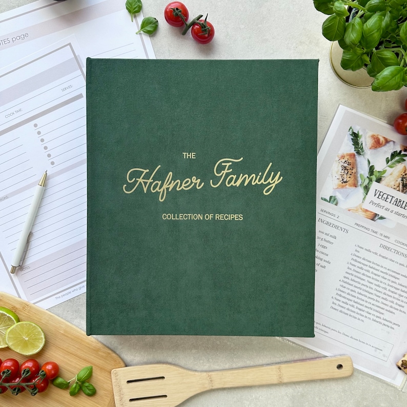 Dark green recipe book with custom text in gold color on the cover.  The book is thick and has a luxurious feel. It's a high-quality, personalized recipe book for storing family recipes.