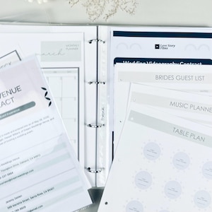 Personalized wedding planner binder to organize your entire wedding in one place — includes all checklists, timelines, budget sheets, and vendor contract sections. Fully customizable cover and spine colors with your names, wedding date, or custom text. Perfect keepsake for brides and wedding planners to stay organized from engagement to wedding day.