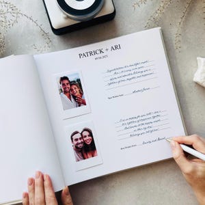 May include: Open white wedding guest book with the names "PATRICK + ARI" and the date "09.06.2025" printed at the top. Two polaroid-style photos are adhered to the left page. Handwritten well wishes and signatures fill the right page.