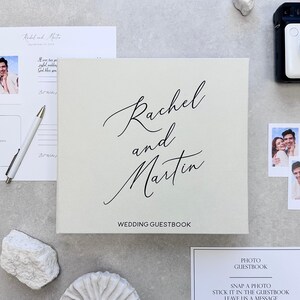 Ivory Instax wedding guest book with elegant black lettering. This modern Polaroid Guest book is more than just a sign-in book, this luxurious and personalized Instax photo album fits all instant film sizes — Instax Mini, Wide, Square, Photo Booth 4x6 prints, and 2x6 photo strips. Our wedding photo guest book that captures every smile, every laugh, and every special guest who made your day unforgettable — a timeless wedding keepsake you’ll treasure forever.