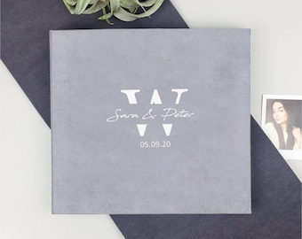 May include: Gray velvet photo album with white lettering that reads "VAT Sara & Peter 05.09.20".