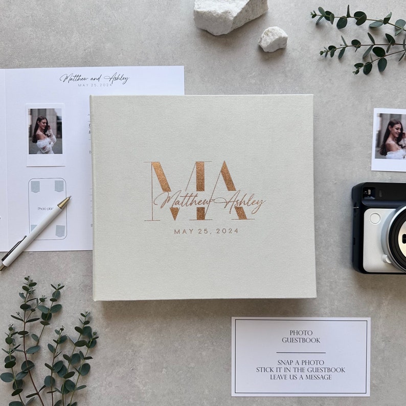 Ivory Instax wedding guest book with elegant Copper foil lettering. This modern Polaroid Guest book is more than just a sign-in book, this luxurious and personalized Instax photo album fits all instant film sizes — Instax Mini, Wide, Square, Photo Booth 4x6 prints, and 2x6 photo strips. Our wedding photo guest book that captures every smile, every laugh, and every special guest who made your day unforgettable — a timeless wedding keepsake you’ll treasure forever.
