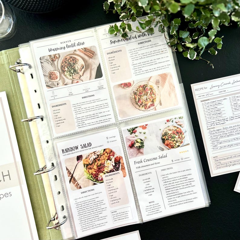 An opened binder showing transparent sleeves of recipe cards in 4x6 inch or 10x15 cm size. There are printed recipe cards as an example. A4 size binder with 4 rings.