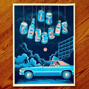 May include: A blue and white poster with the text "It Follows" in red letters. The letters are formed by hanging aluminum cans. The poster also features a blue car driving down a street at night with a full moon in the sky.