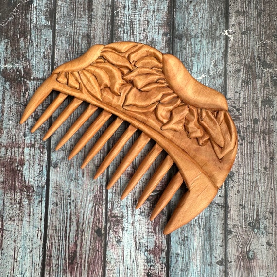 Carved wooden comb discount