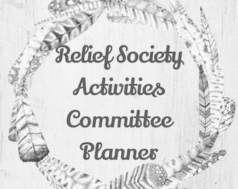 May include: A black and white planner with a wreath of feathers around the title "Relief Society Activities Committee Planner".