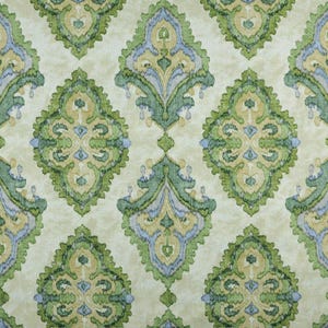 May include: A beige fabric with a repeating pattern of green, blue, and yellow floral motifs. The pattern is intricate and detailed, with a damask-like appearance.