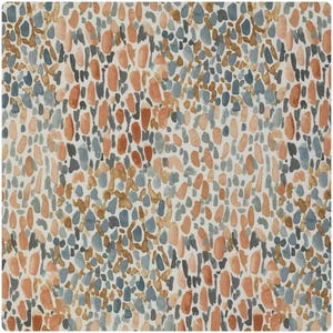 May include: A patterned fabric featuring a repeating design of watercolour-style shapes in orange, blue, grey, and brown. The shapes are scattered on a white background, creating a textured, abstract design. Suitable for various home decor projects.