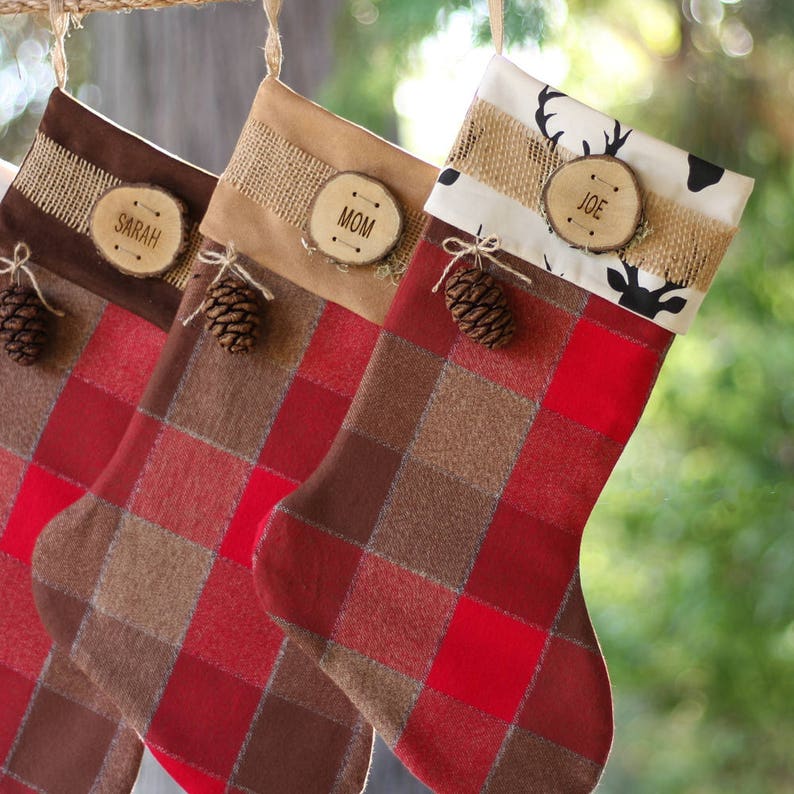 Holiday Stockings Christmas with Wood Slice Name Tag and Redwood Cone Rustic Woodland Christmas Plaid