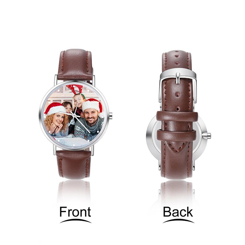 May include: A brown leather strap watch with a silver case. The watch face displays a family photo wearing Santa hats. The back of the watch is also visible. The word "Front" and "Back" are printed below the watch.