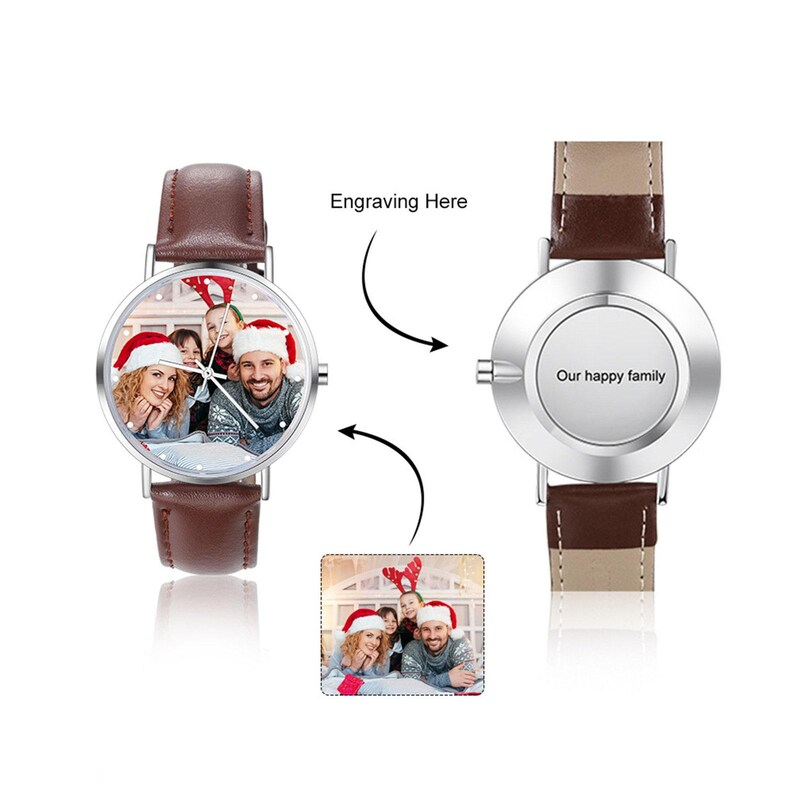 May include: A personalized wristwatch with a brown leather strap. The watch face displays a family photo wearing Santa hats. The back of the watch is engraved with the words "Our happy family". The text "Engraving Here" is also visible.