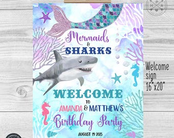 May include: A welcome sign for a mermaid and shark themed birthday party. The sign is blue and purple with a mermaid tail, a shark, and a starfish. The text on the sign reads "Mermaids & Sharks Welcome to Amanda & Matthew's Birthday Party August 19 2025".