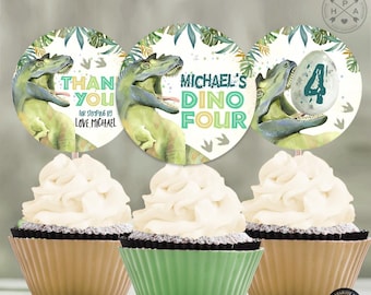 May include: Three cupcakes with white frosting and decorative toppers. The toppers feature dinosaur illustrations and text that reads "Michael's Dino Four", "Thank You for Stomping By Love Michael", and a number 4 on an egg.