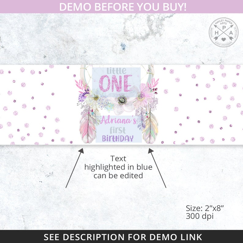 May include: A printable banner for a first birthday party with a pink and purple color scheme. The banner features a dreamcatcher with feathers and flowers, and the text "Little One" and "Adriana's First Birthday".