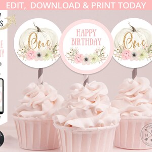 May include: Cupcakes with pink frosting and decorative toppers. The toppers feature a white pumpkin with the word "One" in gold glitter, and floral accents. Another topper says "Happy Birthday". The image also includes text: "Edit, Download & Print Today".