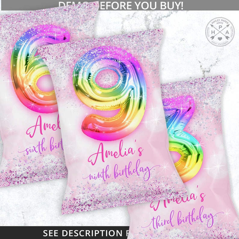 May include: Three pink and white favor bags with a rainbow glitter design. The bags feature a large rainbow balloon number with the text "Amelia's" and the age of the birthday girl. The bags are for a sixth, ninth, and third birthday.