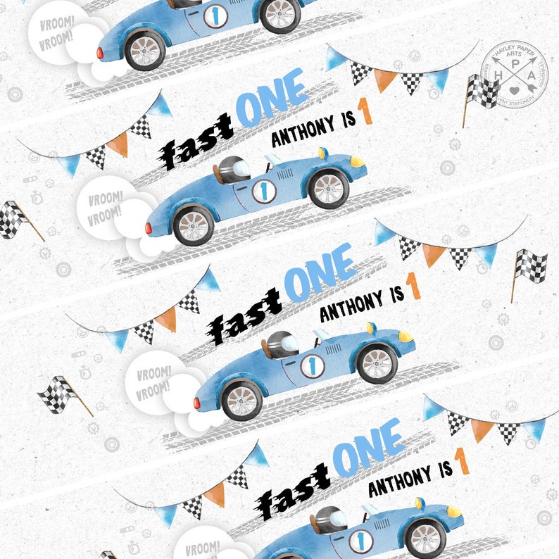 May include: A blue racing car with a white number one on the side is driving on a white background with orange and black chequered flags. The text "fast one" and "Anthony is 1" is written on the image.