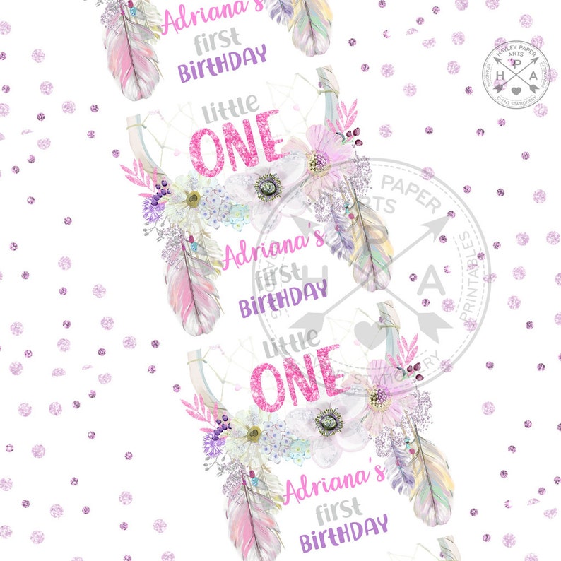 May include: A printable party design featuring a pink and white floral wreath with feathers and the text "Adriana's first birthday" and "Little One".