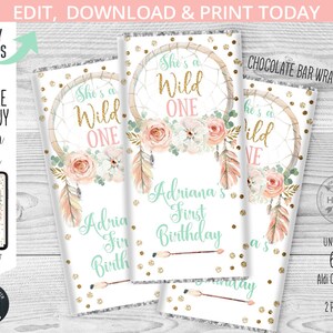 May include: Printable chocolate bar wrapper featuring a dreamcatcher with pink and white flowers, gold glitter, and the text "She's a Wild One". The wrapper is designed for a first birthday party and includes the name "Adriana".