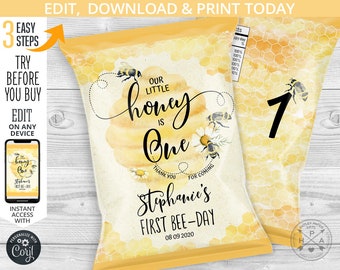 May include: A yellow and white party favor bag with a bee theme. The bag features the text "Our Little Honey is One" and "Stephanie's First Bee-Day" with a date. The design includes bees, daisies, and a honeycomb pattern.